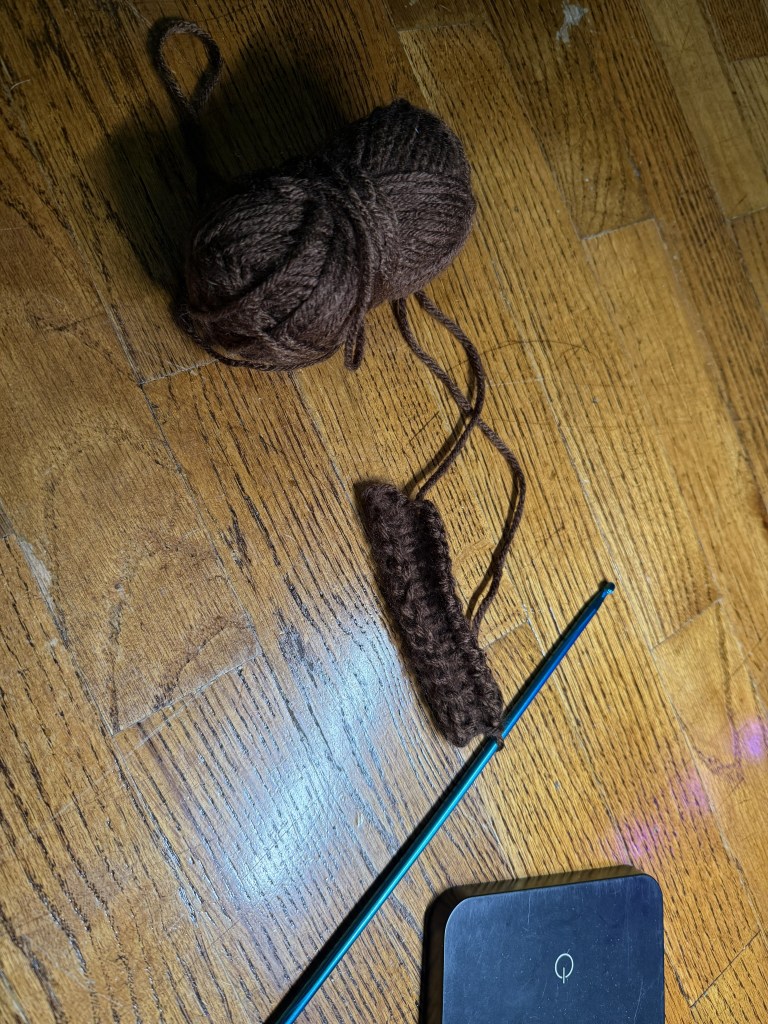 small swatch of Tunisian crochet with brown yarn